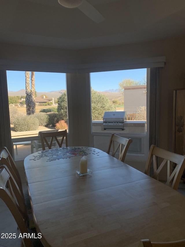 dining room featuring a mountain view