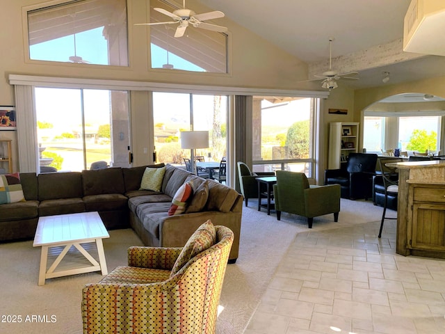 living room with high vaulted ceiling and ceiling fan