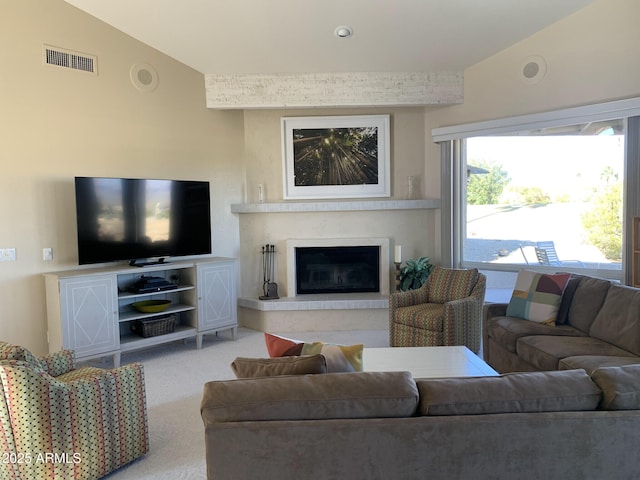 living room with lofted ceiling and light carpet