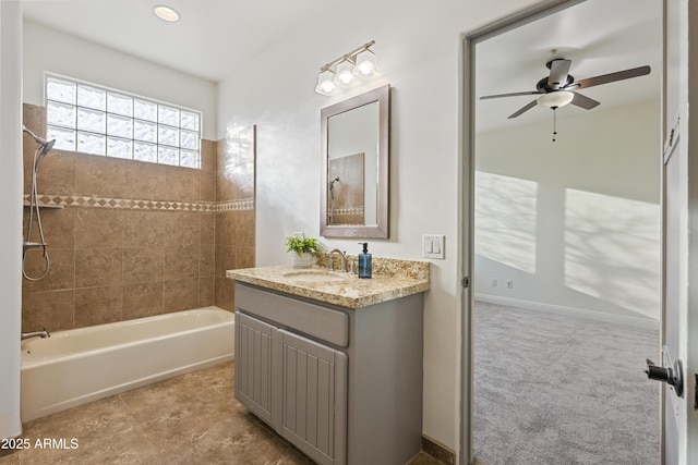 bathroom with shower / bathtub combination, baseboards, vanity, and a ceiling fan