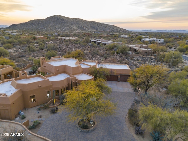 aerial view at dusk with a mountain view