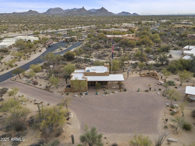 birds eye view of property featuring a desert view and a mountain view