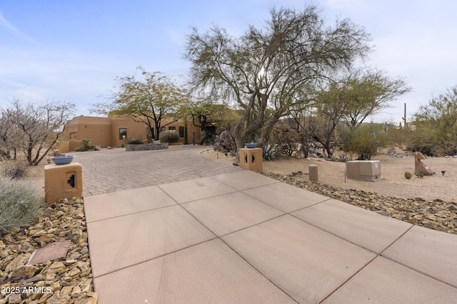 view of front of house with driveway and stucco siding