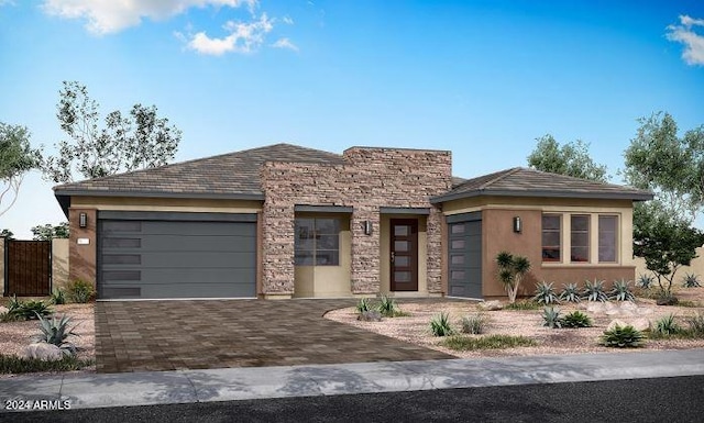 view of front facade with decorative driveway, a garage, stone siding, and stucco siding