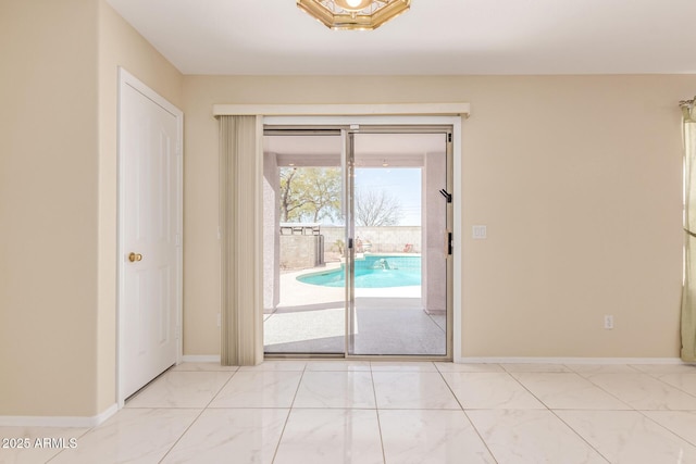 empty room with marble finish floor and baseboards