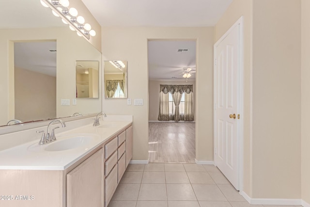 full bathroom featuring a sink, visible vents, tile patterned floors, and double vanity