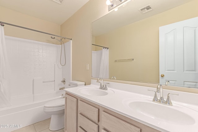 bathroom featuring tile patterned flooring, visible vents, a sink, and toilet