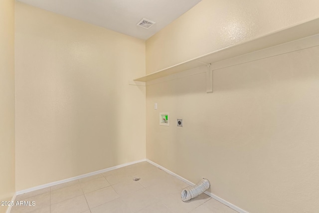 washroom with laundry area, hookup for a washing machine, electric dryer hookup, visible vents, and baseboards