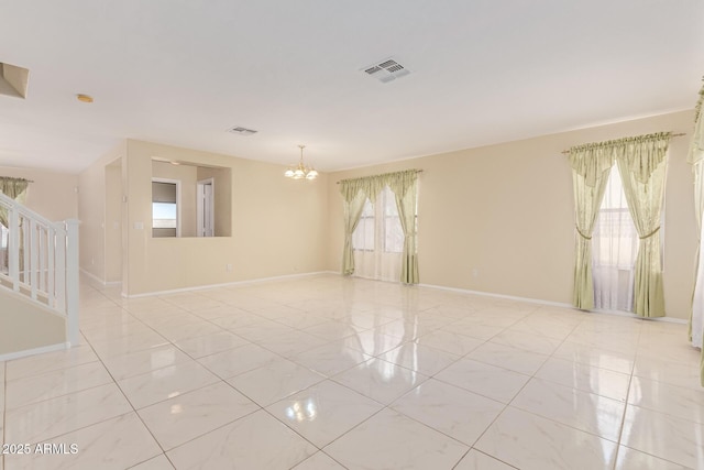 unfurnished room with visible vents, baseboards, an inviting chandelier, and light tile patterned floors