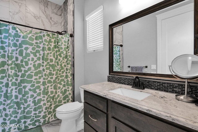 bathroom with backsplash, toilet, walk in shower, and vanity