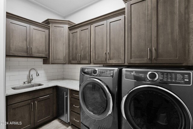 3749 E Juniper Cir, Mesa, AZ 85205 - clothes washing area featuring cabinet space, a sink, separate washer and dryer, and light wood-type flooring