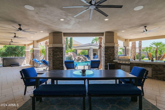 view of patio / terrace with a grill, area for grilling, and ceiling fan