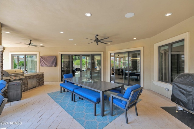 exterior space featuring a grill, area for grilling, and ceiling fan