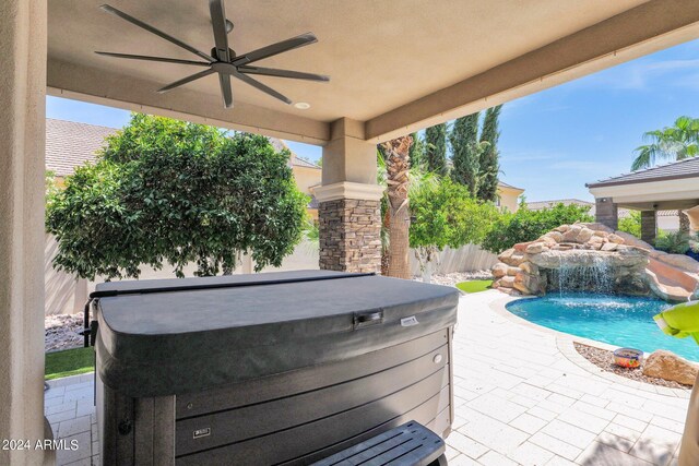 3749 E Juniper Cir, Mesa, AZ 85205 - view of patio with a fenced in pool, a ceiling fan, fence, and a hot tub