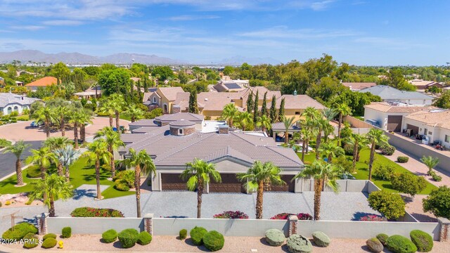 birds eye view of property with a mountain view