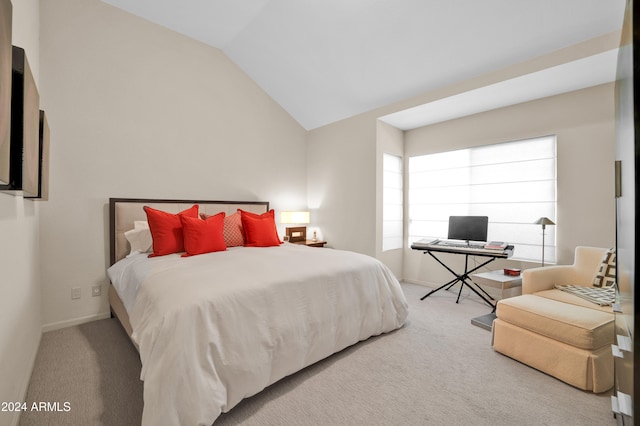 bedroom with carpet and vaulted ceiling