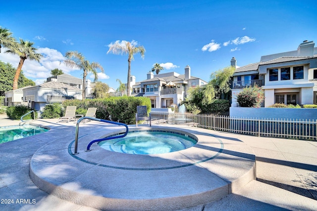 view of pool featuring a community hot tub