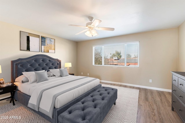 bedroom featuring light wood-type flooring and ceiling fan