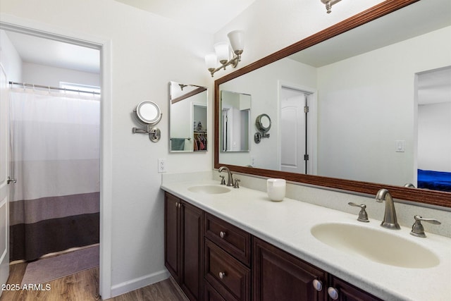 bathroom with vanity and hardwood / wood-style flooring