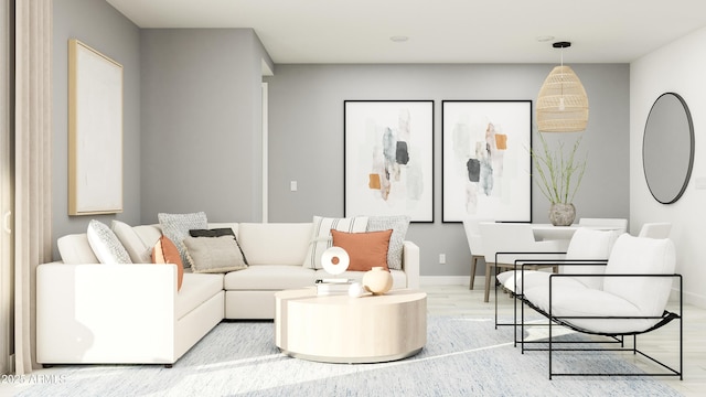 living room with light wood-style flooring and baseboards