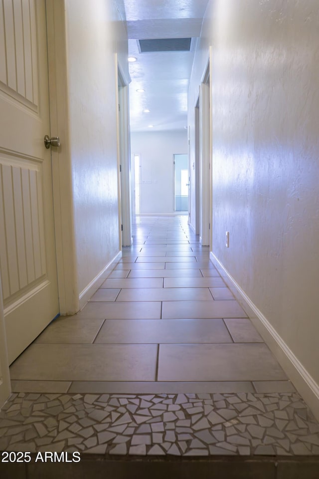 hallway with vaulted ceiling