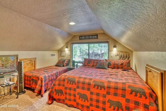 bedroom with carpet, visible vents, vaulted ceiling, and a textured ceiling