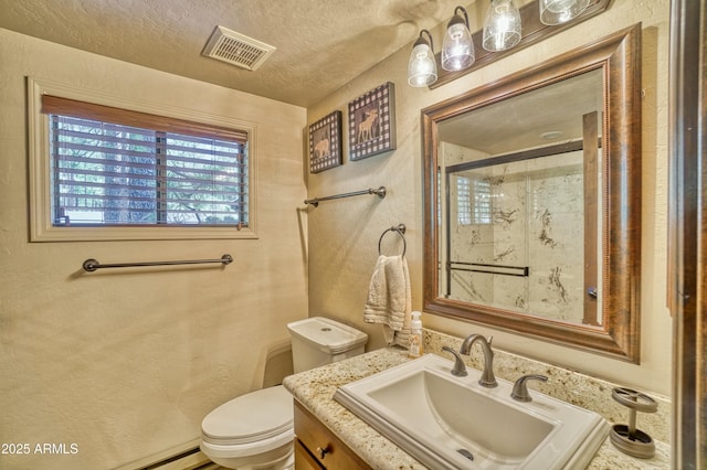 full bathroom featuring visible vents, toilet, a stall shower, vanity, and a textured ceiling