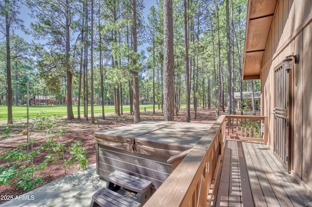 wooden terrace featuring a hot tub