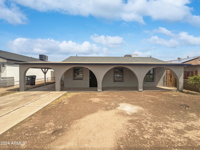 back of property featuring cooling unit