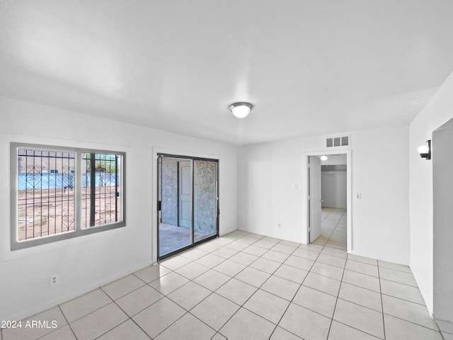 empty room with light tile patterned floors