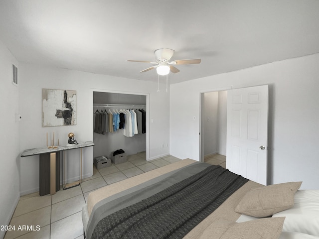 tiled bedroom with a closet and ceiling fan