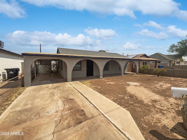 view of front of home featuring a carport