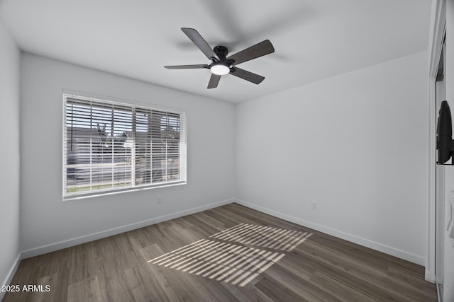 empty room featuring ceiling fan and wood-type flooring