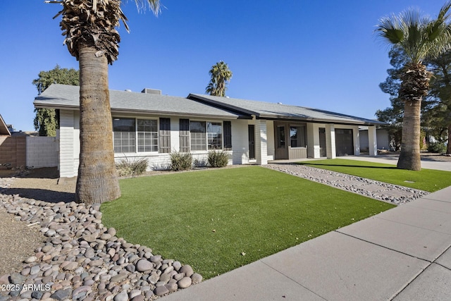 single story home with a front lawn and a garage