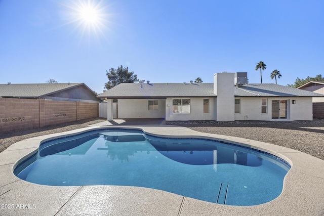 view of swimming pool with central AC unit and a patio area