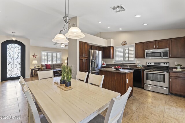 dining room featuring light tile patterned floors, lofted ceiling, recessed lighting, and a ceiling fan