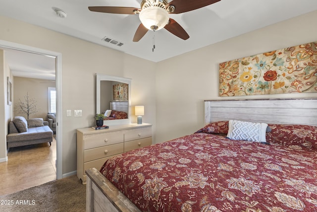 carpeted bedroom featuring baseboards and a ceiling fan