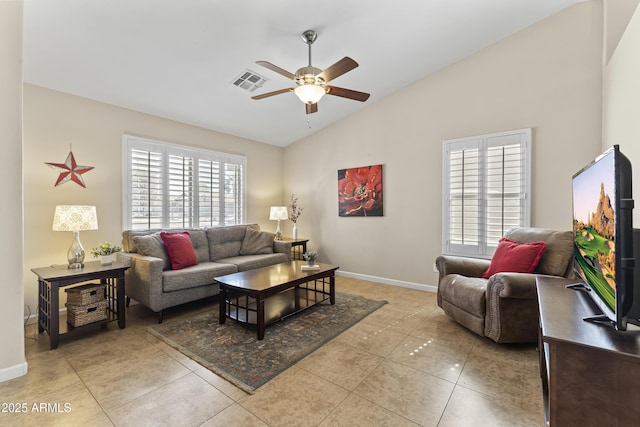 living room featuring a ceiling fan, plenty of natural light, light tile patterned flooring, baseboards, and high vaulted ceiling