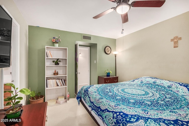 bedroom with ceiling fan and carpet