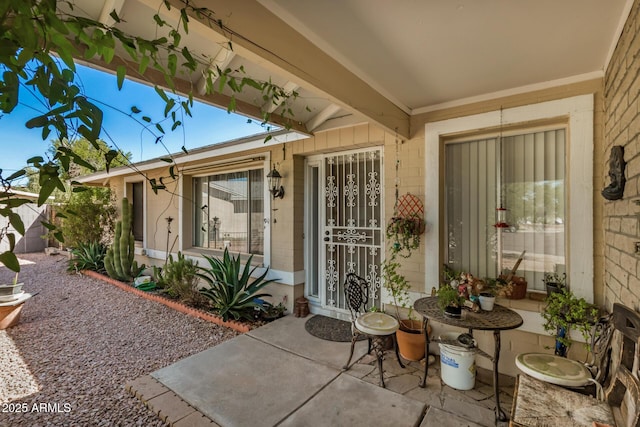 property entrance featuring a patio