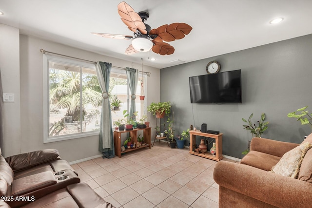 living room with ceiling fan and light tile patterned flooring