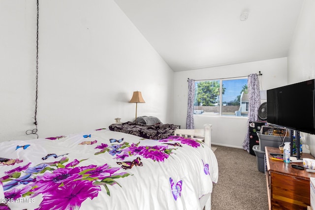 carpeted bedroom featuring lofted ceiling