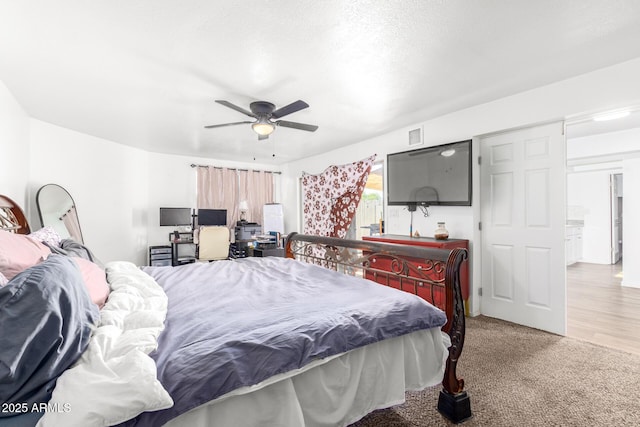 bedroom featuring light carpet and ceiling fan