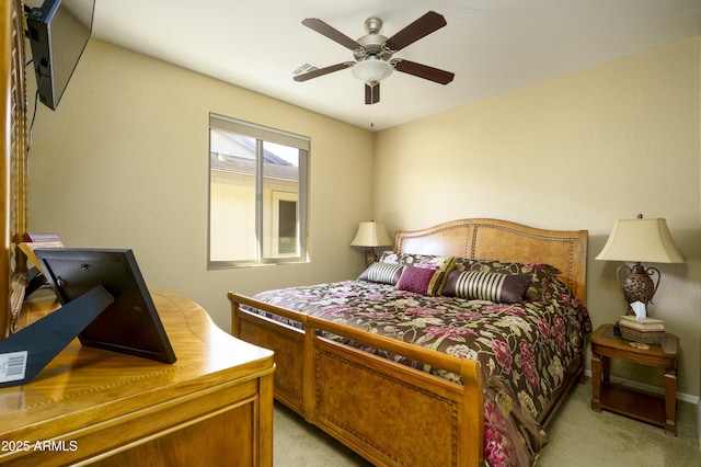 bedroom featuring light carpet, ceiling fan, and visible vents