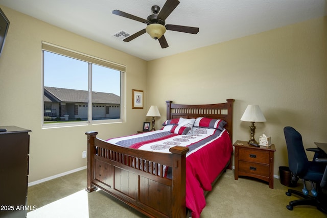 carpeted bedroom with visible vents, ceiling fan, and baseboards