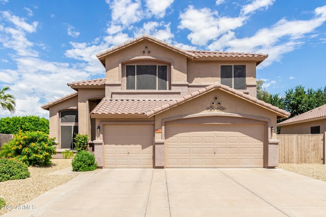 mediterranean / spanish house featuring a garage