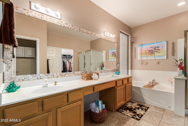 bathroom featuring vanity, tile patterned floors, and plus walk in shower