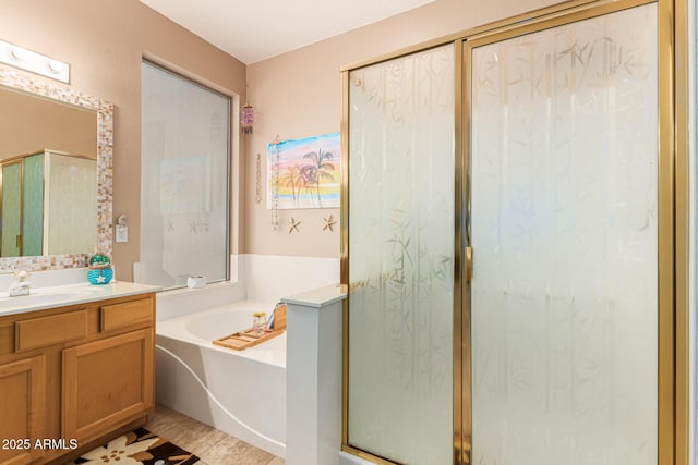 bathroom with vanity, separate shower and tub, and tile patterned flooring