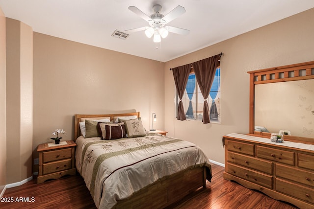 bedroom with dark wood-type flooring and ceiling fan