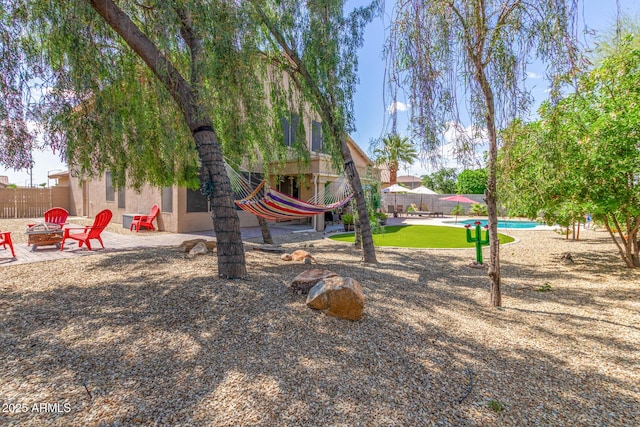 view of playground with an outdoor fire pit